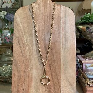 Elegant Gold Necklace with a  Snafflebit Pendant